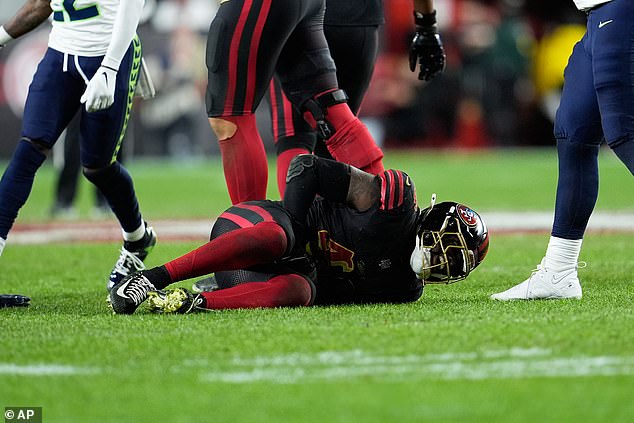 San Francisco 49ers linebacker Tatum Bethune reacts after injuring himself in Saturday's loss