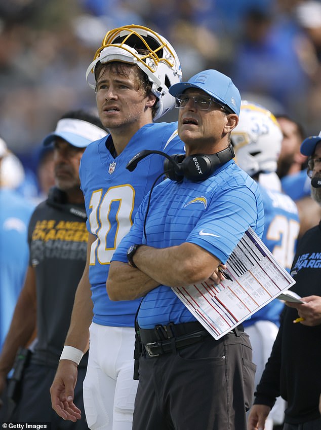 Chargers head coach Jim Harbaugh is seen alongside franchise quarterback Justin Herbert