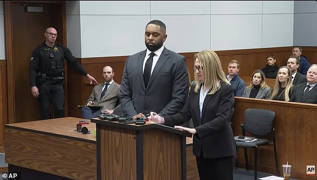 A stony-faced Moore stood beside his attorney during the hearing earlier this month
