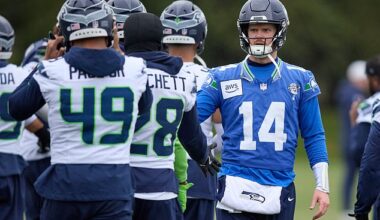 Seattle Seahawks quarterback Sam Darnold (14) greets players during a practice Thursday