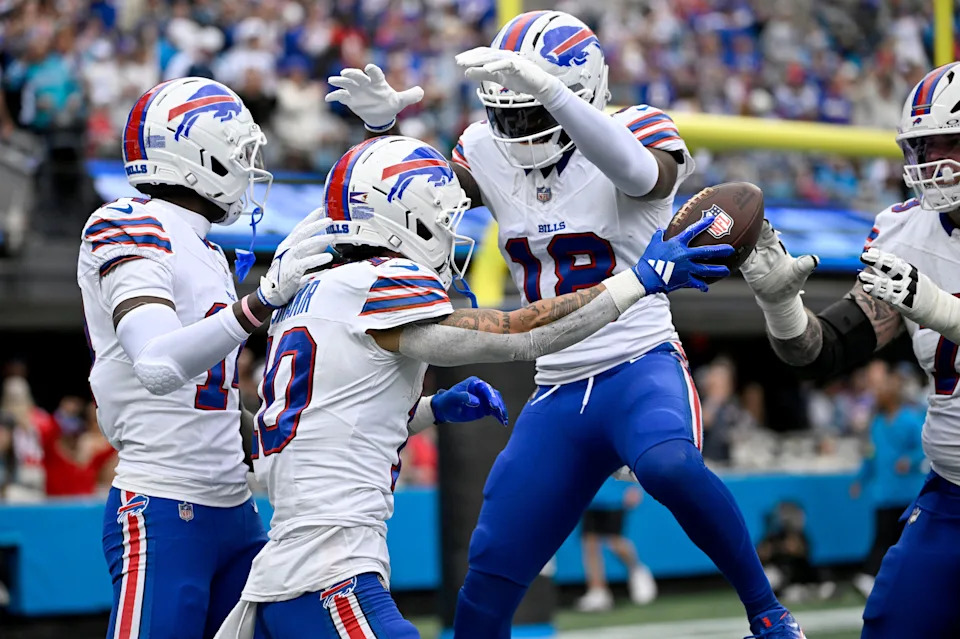Oct 26, 2025; Charlotte, North Carolina, USA; Buffalo Bills wide receiver Khalil Shakir (10) celebrates with wide receiver Elijah Moore (18) and teammates after a touchdown during the second half against the Carolina Panthers at Bank of America Stadium. Mandatory Credit: Bob Donnan-Imagn Images