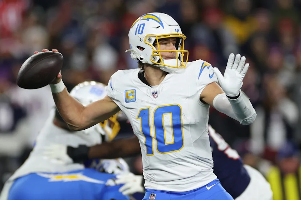 FOXBOROUGH, MASSACHUSETTS - JANUARY 11: Justin Herbert #10 of the Los Angeles Chargers in action during the AFC Wild Card Playoff game against the New England Patriots at Gillette Stadium on January 11, 2026 in Foxborough, Massachusetts. (Photo by Sarah Stier/Getty Images)