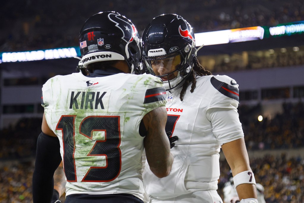 Houston Texans players Christian Kirk and C.J. Stroud celebrate after a touchdown.