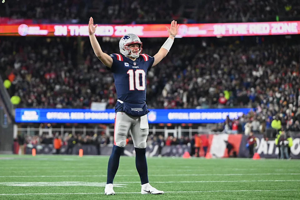 New England Patriots quarterback Drake Maye reacts to a Patriots touchdown scored against the Miami Dolphins.