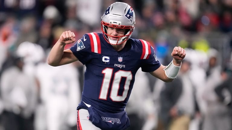 New England Patriots quarterback Drake Maye celebrates after a touchdown...