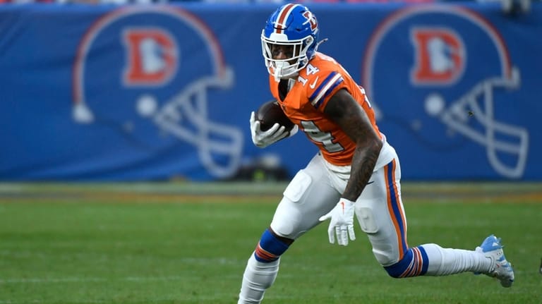 Denver Broncos wide receiver Courtland Sutton (14) runs against the...