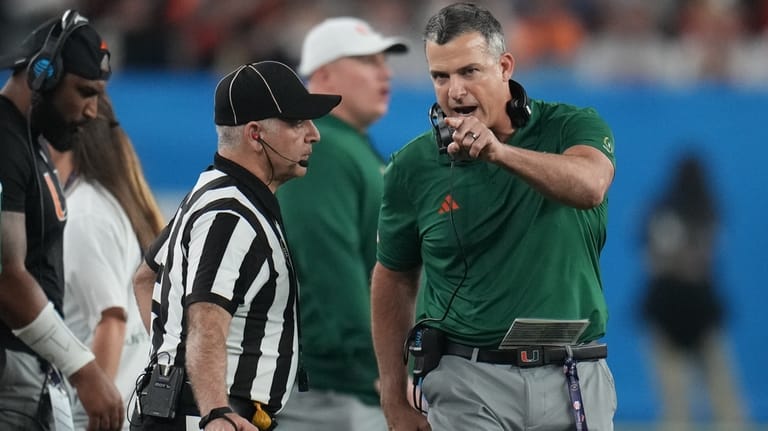 Miami head coach Mario Cristobal yells from the sideline during...