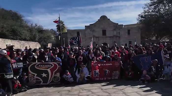 Houston Texans fans rally at the Alamo ahead of playoff game