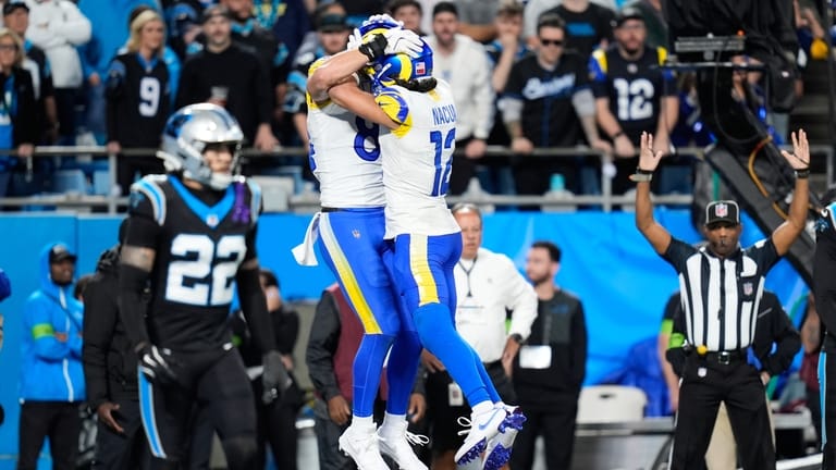 Los Angeles Rams tight end Colby Parkinson, center left, celebrates...
