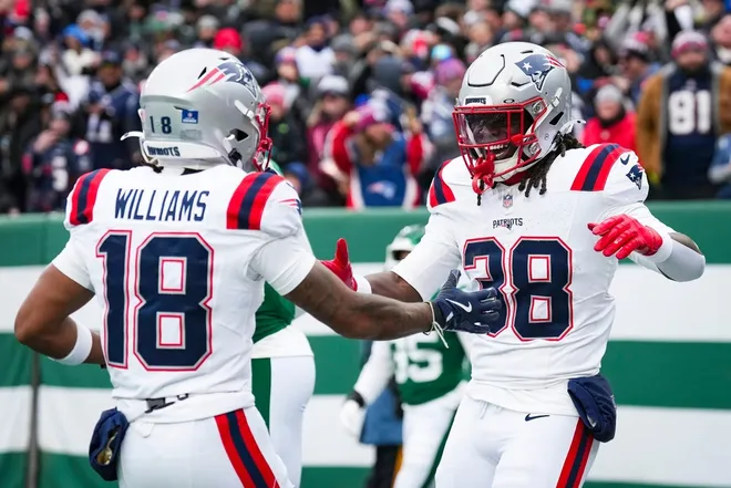 New England Patriots running back Rhamondre Stevenson (38) and New England Patriots wide receiver Kyle Williams (18) celebrate in the end zone during a game against the New York Jets at MetLife Stadium, Dec 28, 2025, East Rutherford, NJ, USA.