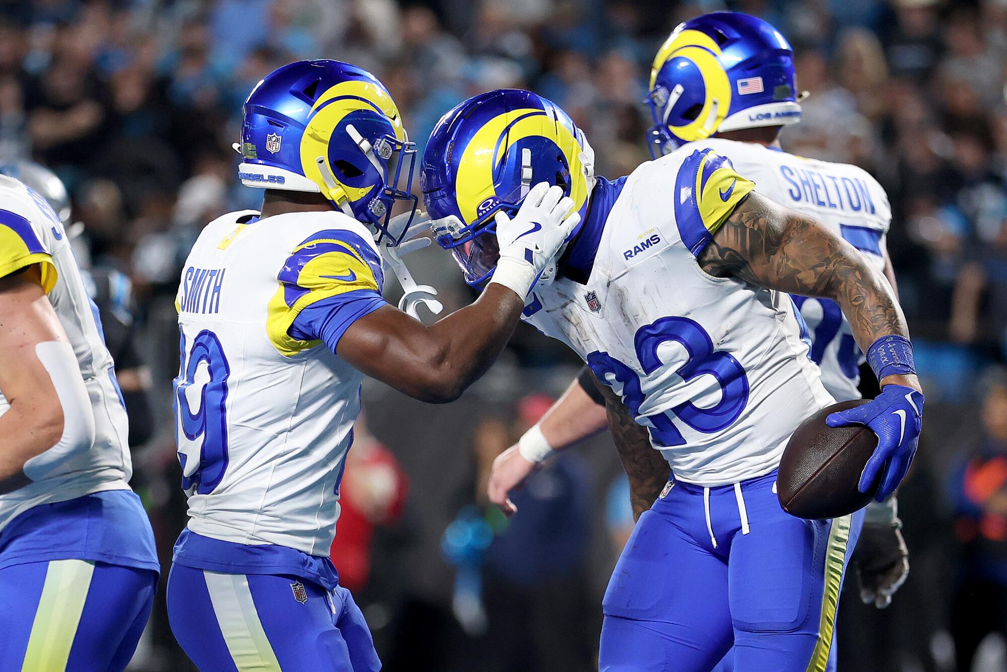 Rams running back Kyren Williams, right, celebrates with wide receiver Xavier Smith after scoring a touchdown.