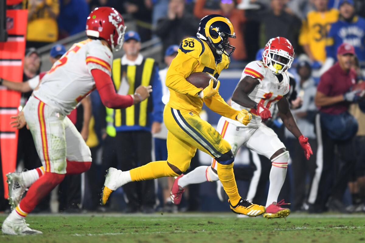 Rams linebacker Samson Ebukam scores on an interception return against the Kansas City Chiefs.