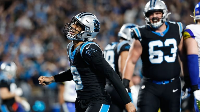 Carolina Panthers quarterback Bryce Young (9) celebrates after scoring a...