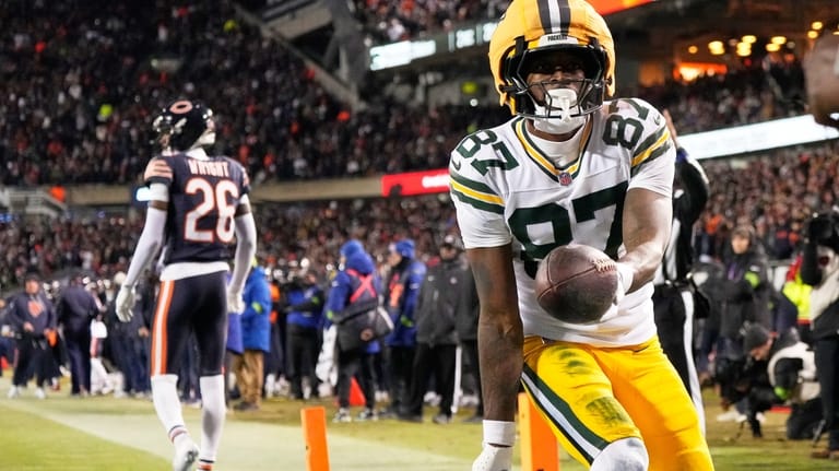 Green Bay Packers' Romeo Doubs celebrates his touchdown catch during...