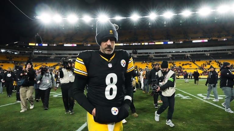 Pittsburgh Steelers quarterback Aaron Rodgers (8) leaves the field after...