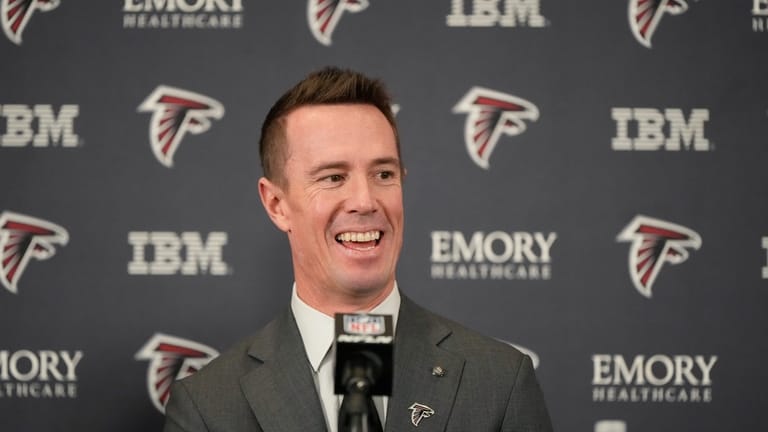 Former Falcons quarterback Matt Ryan speaks during a news conference...