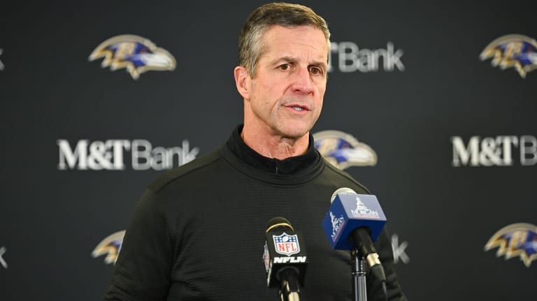 Baltimore Ravens head coach John Harbaugh speaks during a news...
