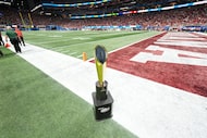 The Peach Bowl NCAA college football playoff semifinal trophy is seen on the field before...