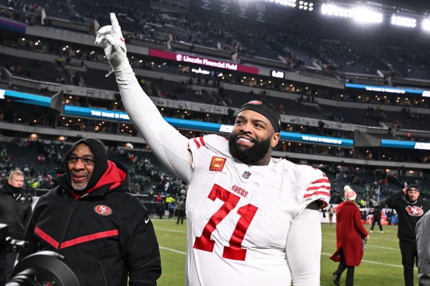 San Francisco 49ers offensive tackle Trent Williams (71) celebrates as he walks off the field after an NFL wild card playoff football game against the Philadelphia Eagles, Sunday, Jan. 11, 2026, in Philadelphia. (AP Photo/Terrance Williams)