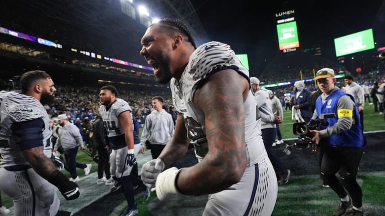 Seattle Seahawks defensive tackle Leonard Williams reacts after an NFL...