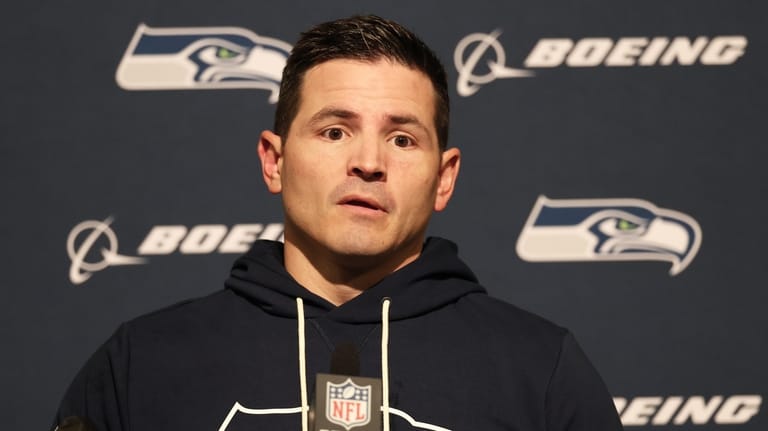 Seattle Seahawks head coach Mike Macdonald speaks at a news...