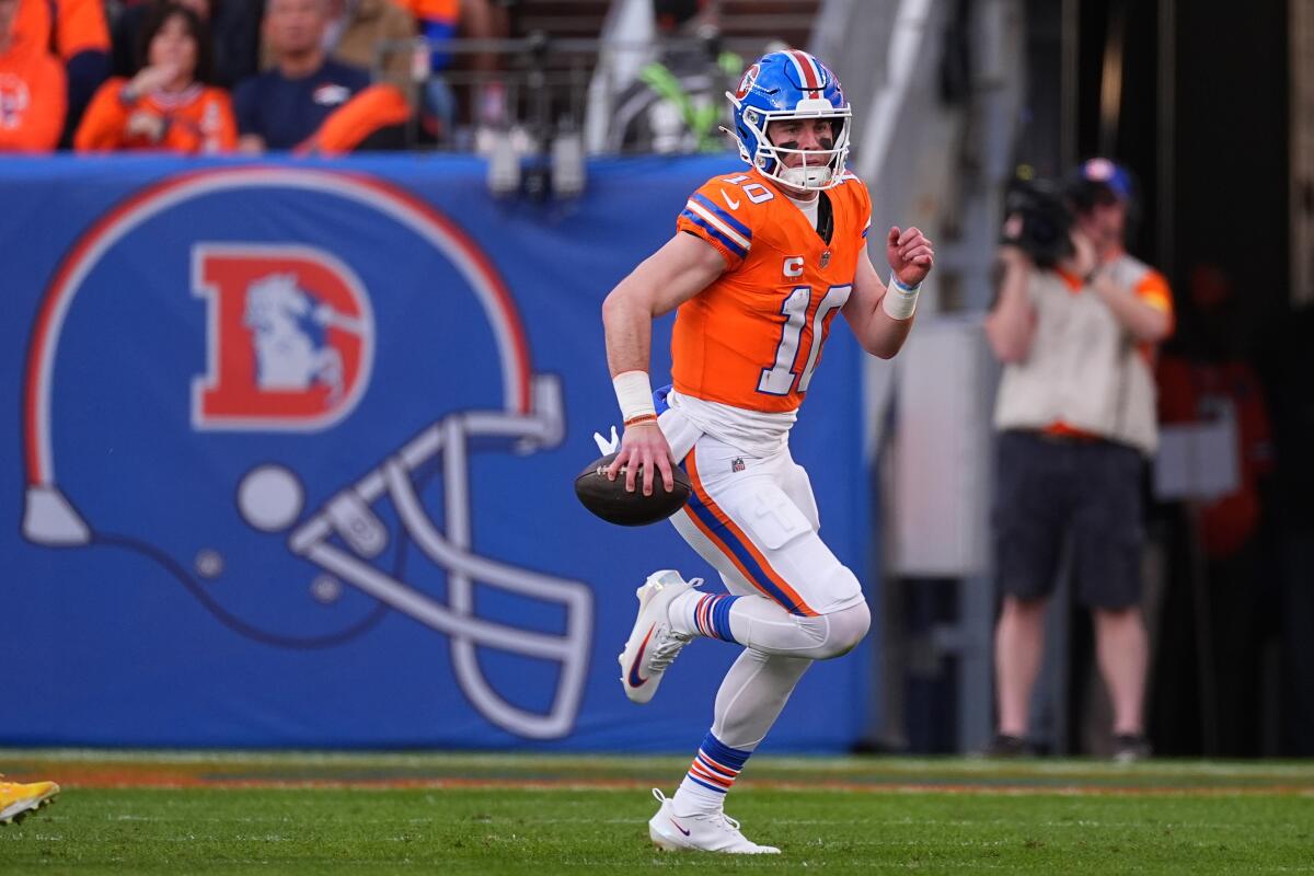 Denver Broncos quarterback Bo Nix scrambles during a win over the Chargers on Jan. 4.