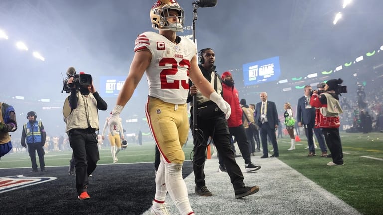 San Francisco 49ers' Christian McCaffrey walks off the field after...