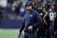 Seattle Seahawks head coach Mike Macdonald watches from the sideline during the second half...