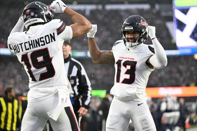 Jan 18, 2026; Foxborough, MA, USA; Houston Texans wide receiver Christian Kirk (13) celebrates a touchdown with wide receiver Xavier Hutchinson (19) in the second quarter against the New England Patriots in an AFC Divisional Round game at Gillette Stadium. Mandatory Credit: Brian Fluharty-Imagn Images