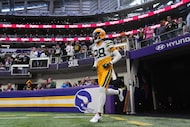 Green Bay Packers cornerback Trevon Diggs runs onto the field before an NFL football game...