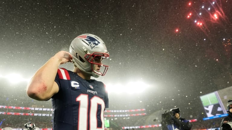 New England Patriots quarterback Drake Maye (10) walks off the...