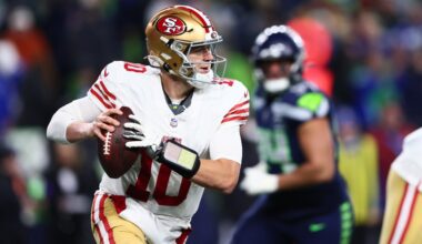 San Francisco 49ers quarterback Mac Jones rolls out to pass against the Seattle Seahawks