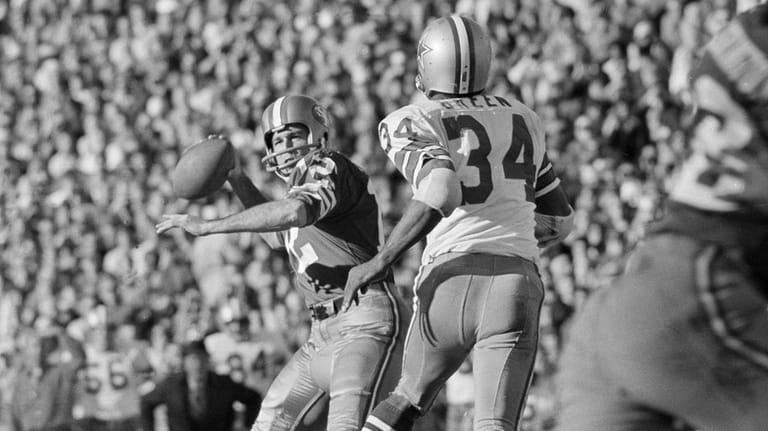 San Francisco 49ers quarterback John Brodie looks to pass as...