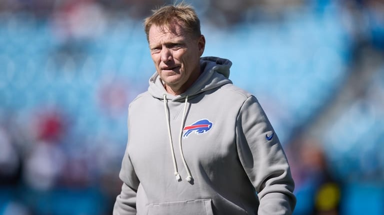 Buffalo Bills special teams coordinator Chris Tabor walks on the...