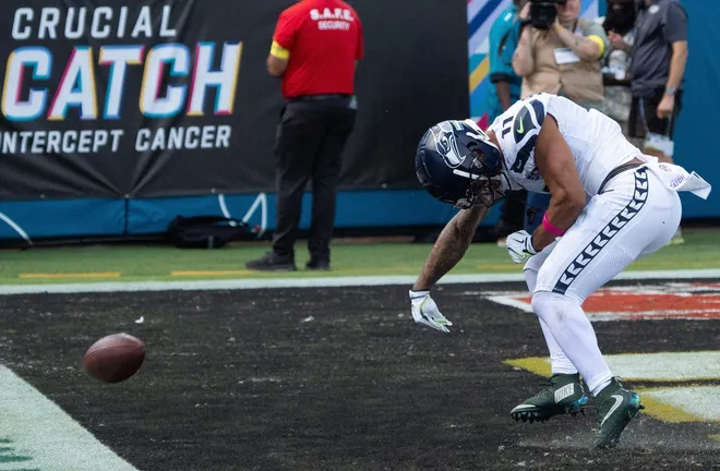 Seattle Seahawks wide receiver Jaxon Smith-Njigba (11) spikes the ball after scoring a touchdown during the second quarter in an NFL football game at EverBank Stadium, Sunday, Oct. 12, 2025, in Jacksonville, Fla. [Doug Engle/Florida Times-Union]