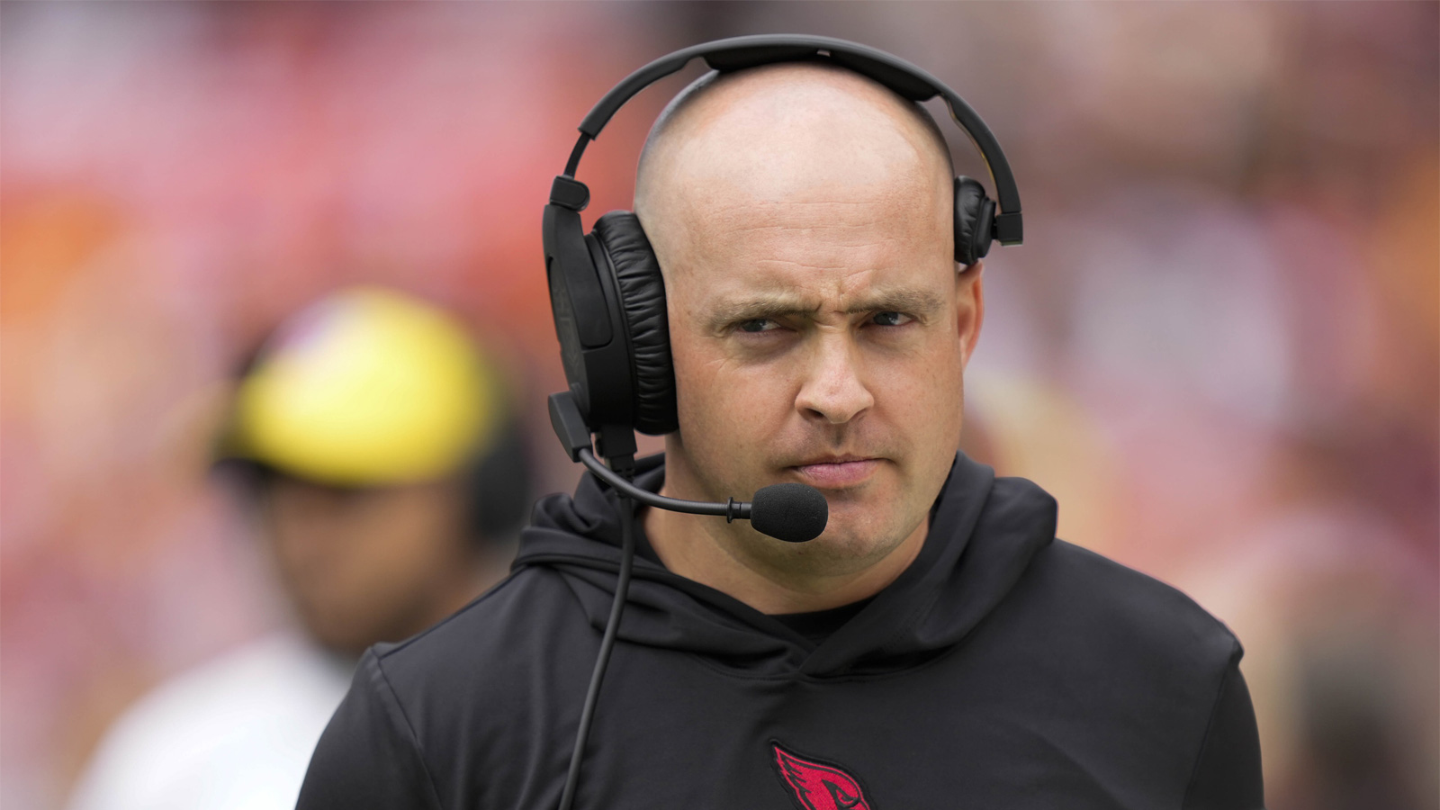 Arizona Cardinals offensive coordinator Drew Petzing walks on the sideline before the game against the Washington Commanders at FedExField