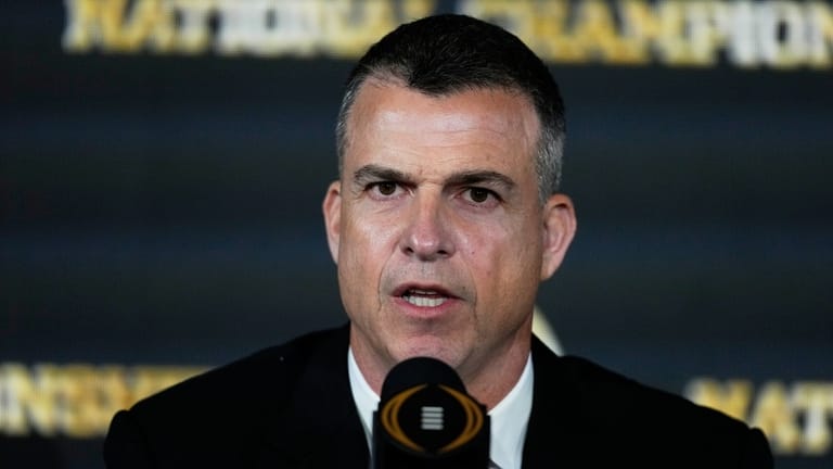 Miami head coach Mario Cristobal speaks during news conference ahead...