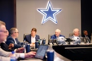 Dallas Cowboys owner Jerry Jones (center), COO Stephen Jones (right) and head coach Brian...