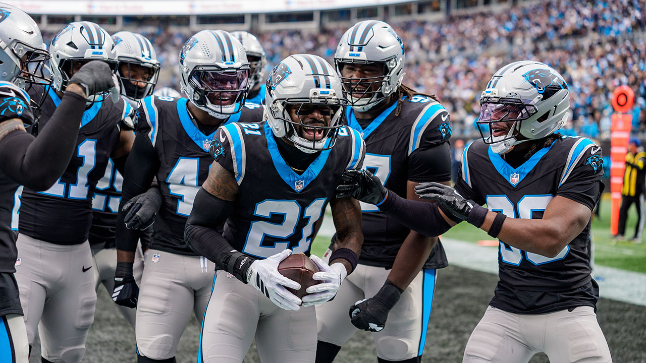 Panthers safety Nick Scott (21) celebrates an interception during a game against the Los Angeles Rams on Nov. 30, in Charlotte.