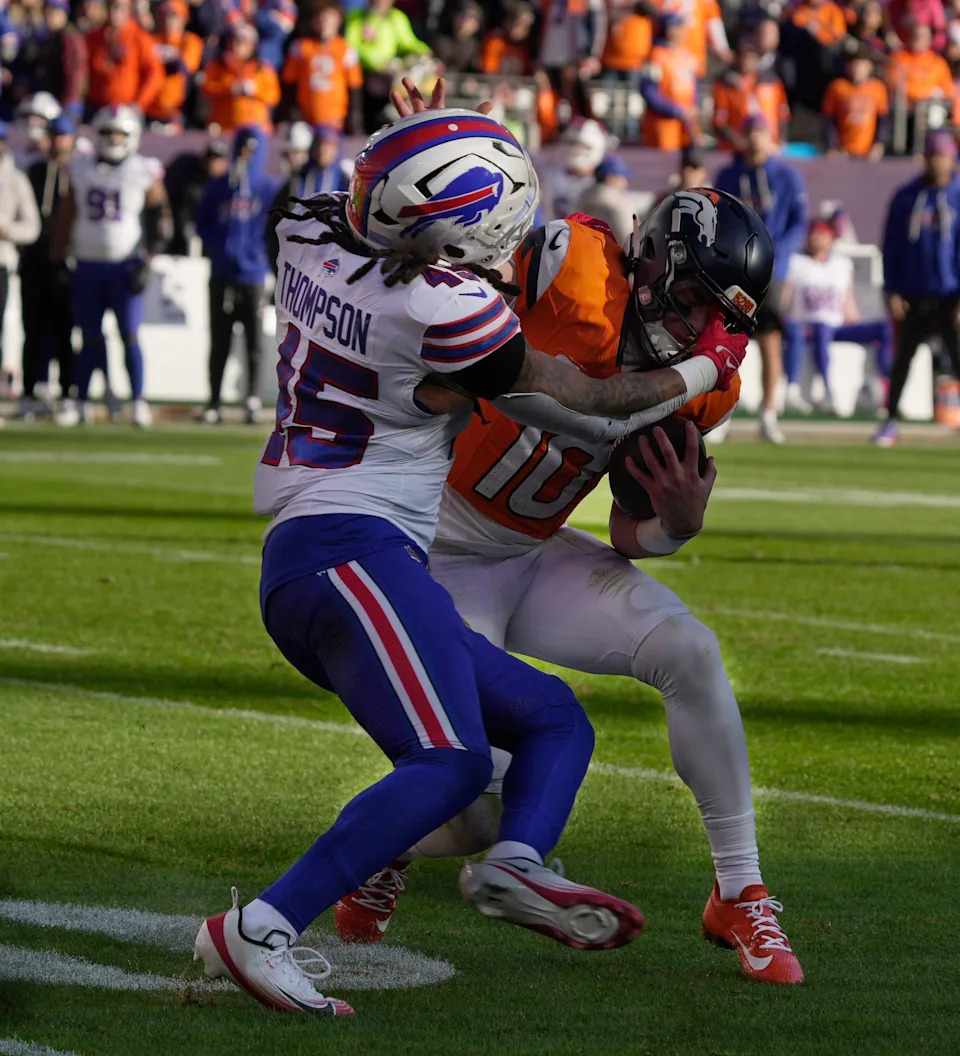 Buffalo Bills linebacker Shaq Thompson sacks Denver Broncos quarterback Bo Nix who kept the ball and was going to run with it during first half action at Empower FIeld at Mile High in Denver, Colorado on Jan. 17, 2026.