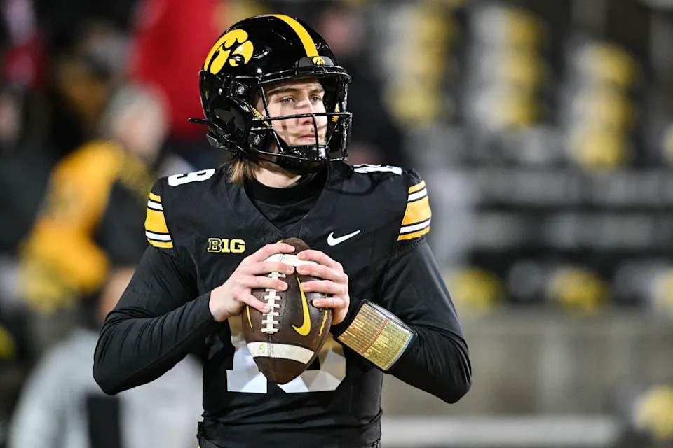 Nov 29, 2024; Iowa City, Iowa, USA; Iowa Hawkeyes quarterback Jackson Stratton (19) warms up before the game against the Nebraska Cornhuskers at Kinnick Stadium. Mandatory Credit: Jeffrey Becker-Imagn Images