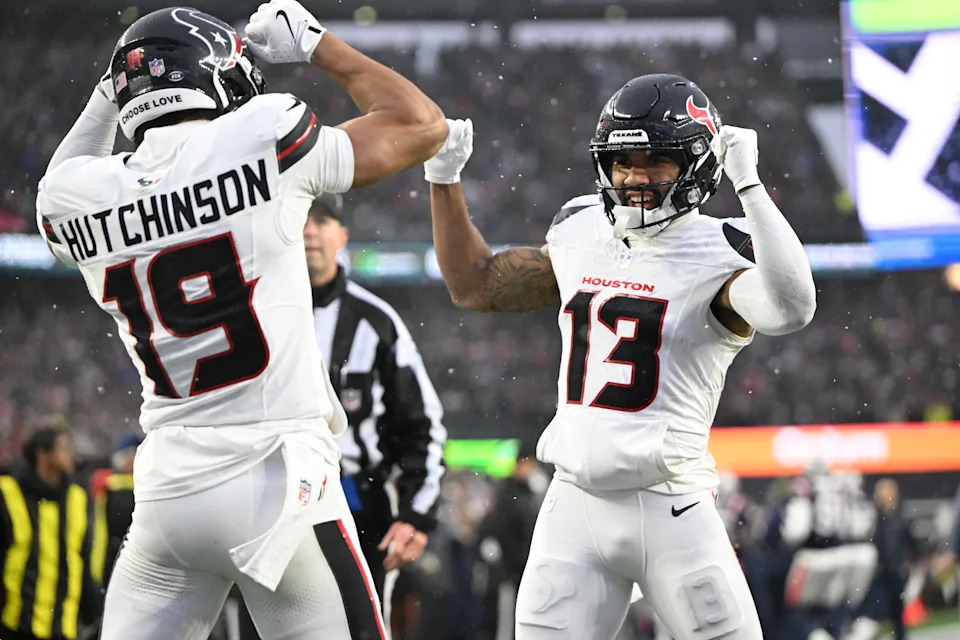 Jan 18, 2026; Foxborough, MA, USA; Houston Texans wide receiver Christian Kirk (13) celebrates a touchdown with wide receiver Xavier Hutchinson (19) in the second quarter against the New England Patriots in an AFC Divisional Round game at Gillette Stadium. Mandatory Credit: Brian Fluharty-Imagn Images