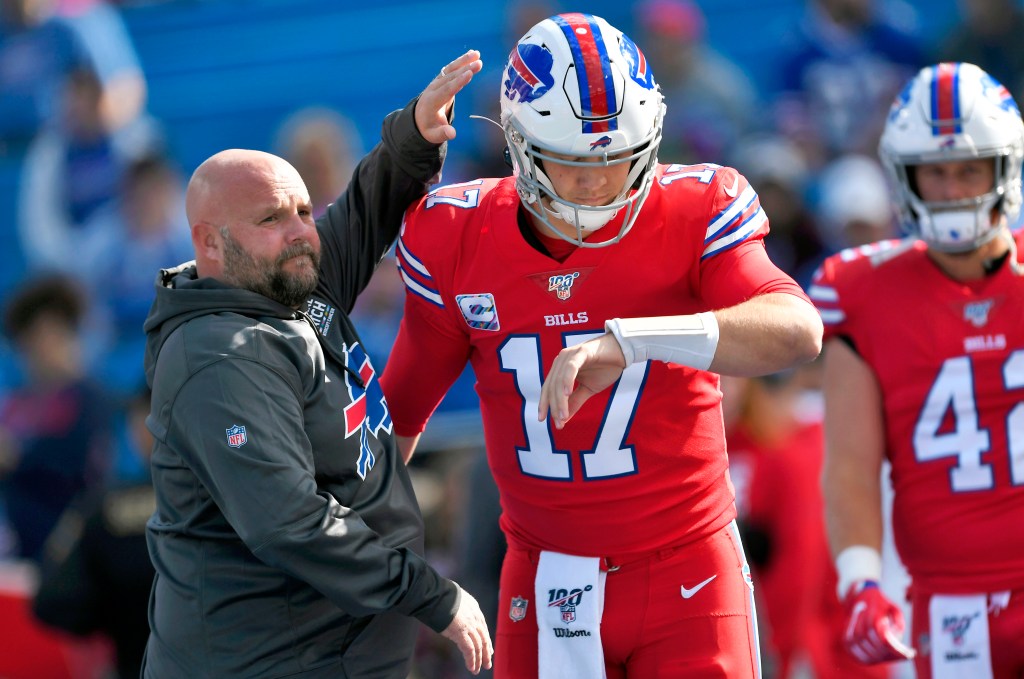 Buffalo Bills offensive coordinator Brian Daboll, left, encourages quarterback Josh Allen as he warms up before an NFL football game Miami Dolphins, Sunday, Oct. 20, 2019, in Orchard Park, N.Y. 