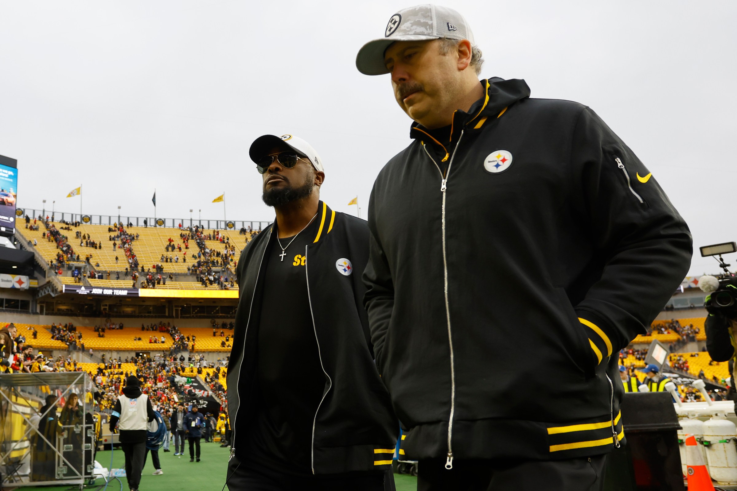 Head coach Mike Tomlin and Offensive coordinator Arthur Smith of the Pittsburgh Steelers walk off the field after the game against the Kansas City Chiefs at Acrisure Stadium on December 25, 2024 in Pittsburgh, Pennsylvania.