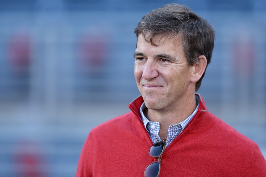 Eli Manning is seen on the sidelines prior to the game between the Tulane Green Wave and the Ole Miss Rebels during the 2025 College Football Playoff First Round Game at Vaught-Hemingway Stadium on December 20, 2025 in Oxford, Mississippi. 