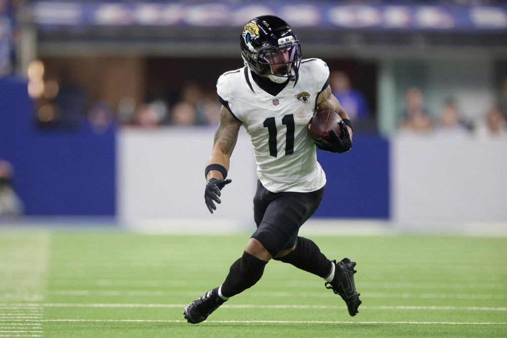 Jacksonville Jaguars player Jamal Agnew (11) carrying the ball during a game against the Indianapolis Colts.