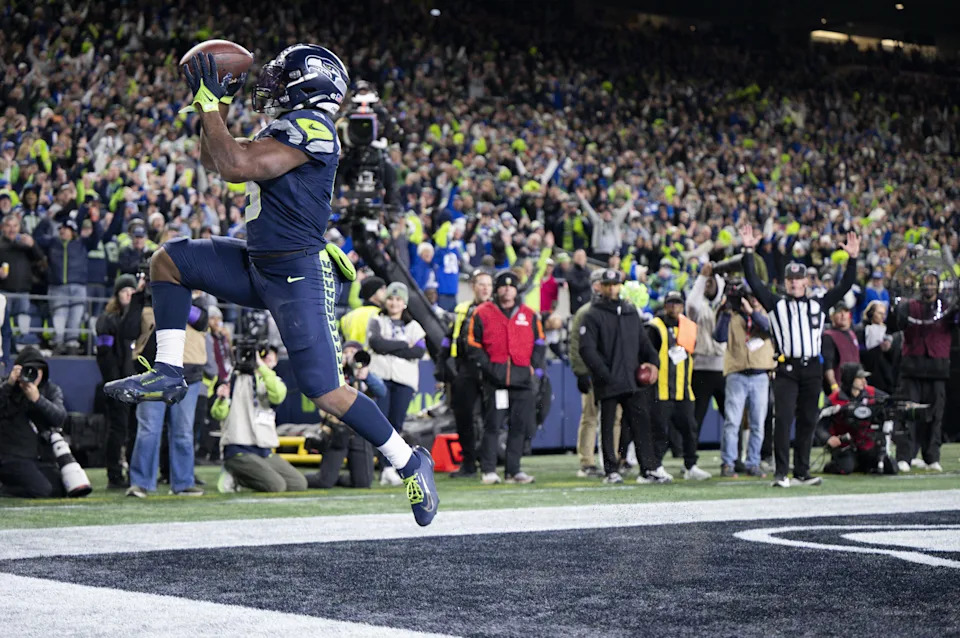 Seattle Seahawks running back Kenneth Walker III (9) leaps through the back of the end zone after scoring his third touchdown during the fourth quarter of the NFC Divisional Round game against the San Francisco 49ers at Lumen Field, on Saturday, Jan. 17, 2026, in Seattle.