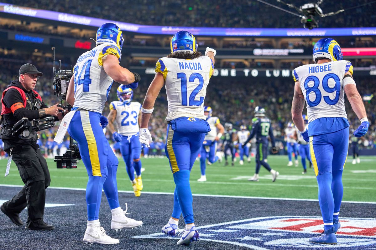 Los Angeles Rams wide receiver Puka Nacua #12 scores a touchdown and celebrates with teammates during the NFC Championship Game against the Seattle Seahawks, on Sunday January 25, 2026 in Seattle, Washington.  