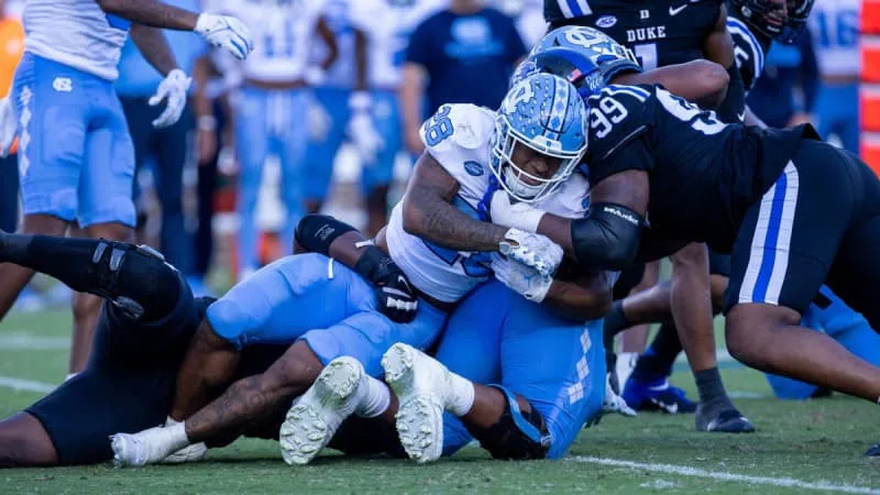 NCAA, College League, USA Football 2024: North Carolina at Duke Sep 28 September 28, 2024: North Carolina Tar Heels running back Omarion Hampton 28 is stoped by Duke Blue Devils defensive tackle Aaron Hall 99 during the first half of the ACC Football matchup at Wallace Wade Stadium in Durham, NC. Scott Kinser/CSM Credit Image: Â Scott Kinser/Cal Media Durham Nc United States EDITORIAL USE ONLY Copyright: xx ZUMA-20240928_zma_c04_277.jpg ScottxKinserx csmphotothree299526