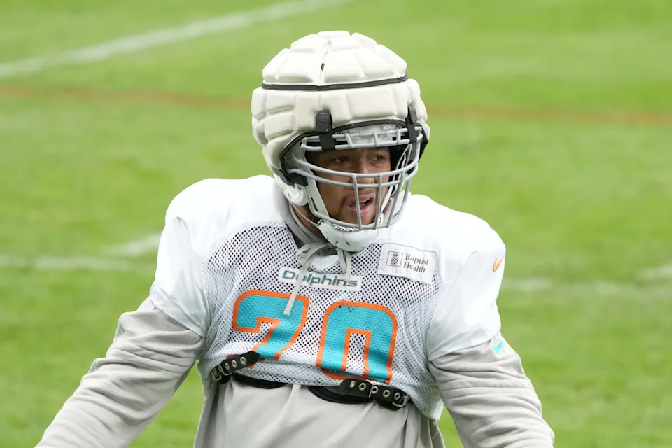 Nov 2, 2023; Frankfurt, Germany; Miami Dolphins offensive tackle Kendall Lamm (70) wears a Guardian helmet cap during practice at the PSD Bank Arena. Kirby Lee-USA TODAY Sports